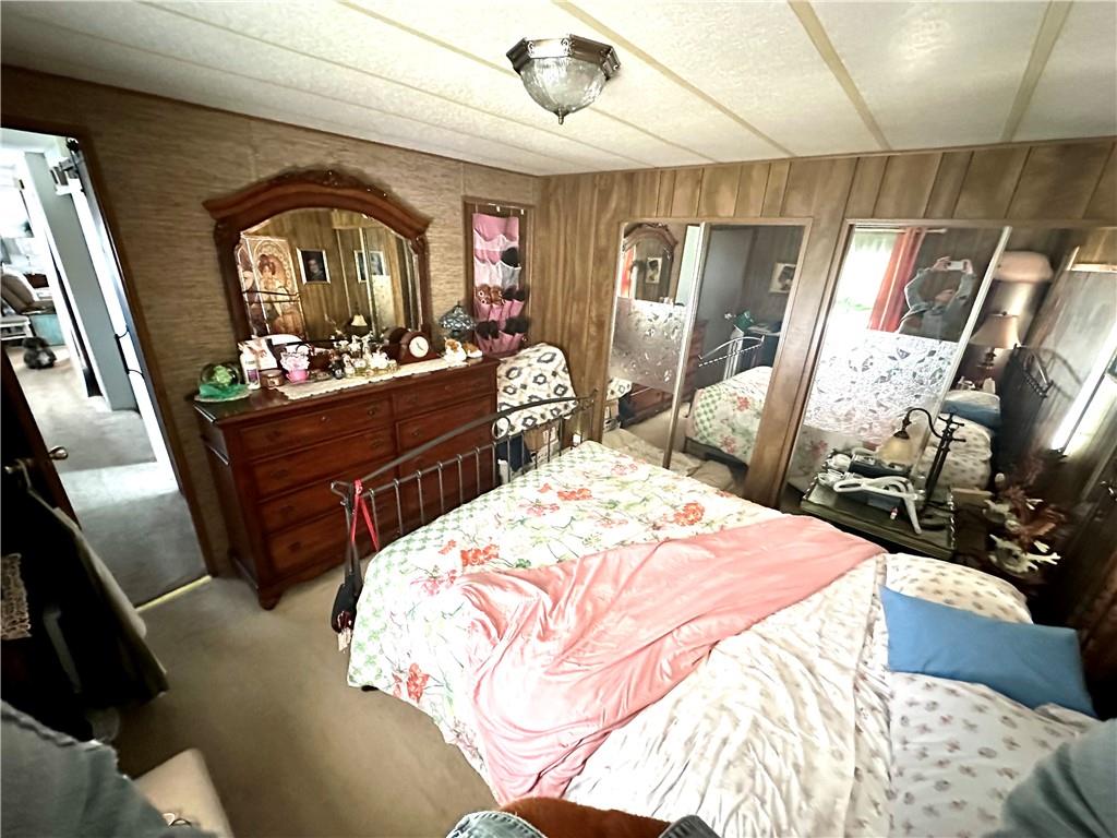 412 Richmond Road Imperial, PA 15126 - Photo 10 of 12 a bed room with a bed mirror and a sink