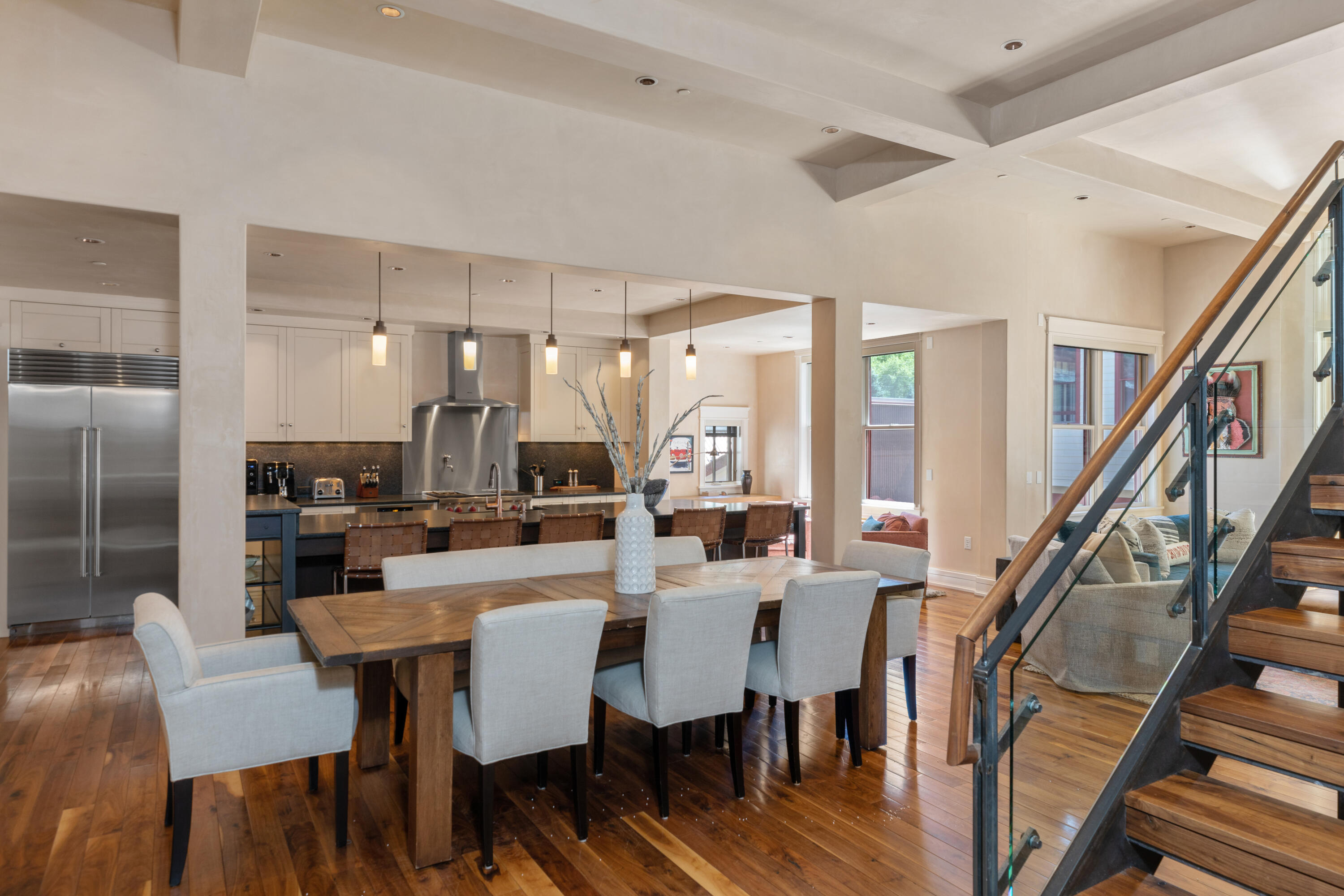 398 South Davis Street, Unit C302 Telluride, CO 81435 - Photo 13 of 14 a view of a dining room with furniture wooden floor and a chandelier