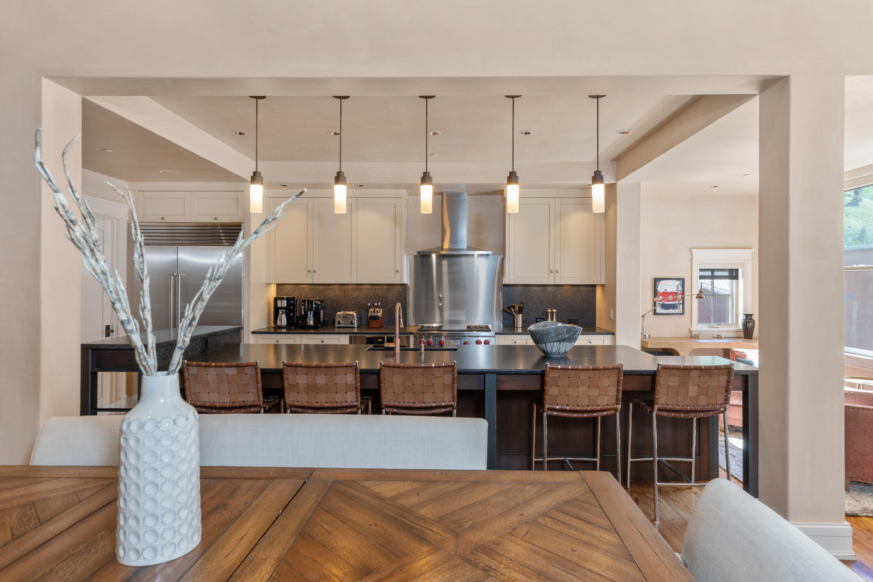 398 South Davis Street, Unit C302 Telluride, CO 81435 - Photo 7 of 14 a large kitchen with a table and chairs