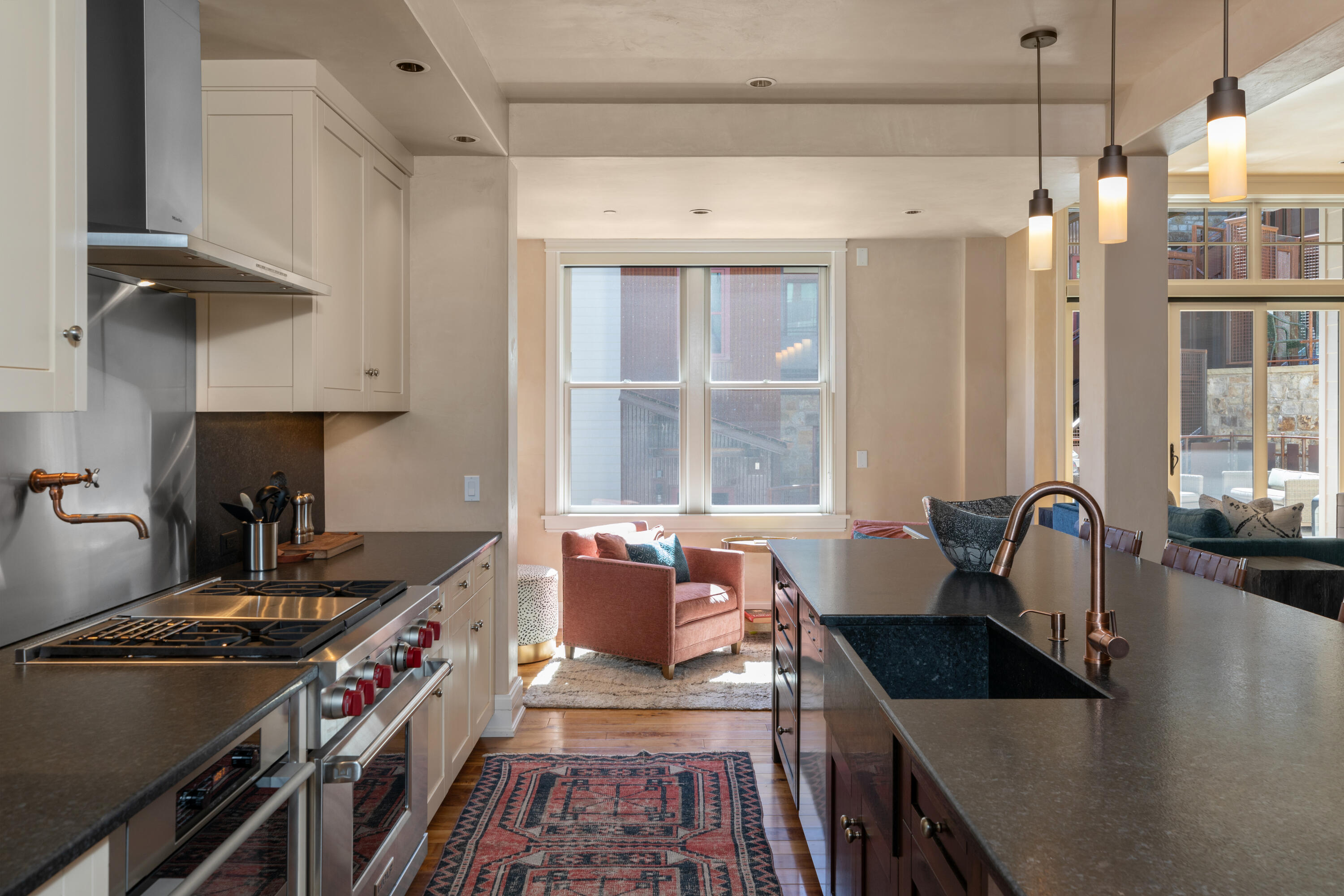 398 South Davis Street, Unit C302 Telluride, CO 81435 - Photo 9 of 14 a kitchen with granite countertop a stove and a sink