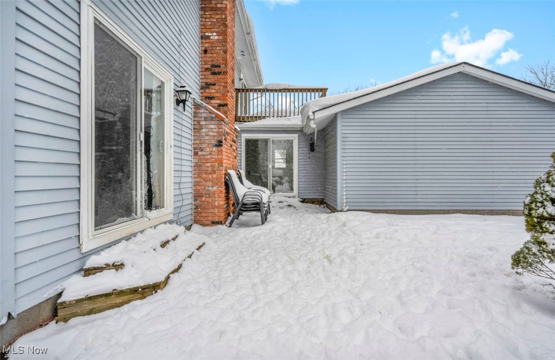 3961 Dayton Road Madison, OH 44057 - Photo 31 of 36 View of snow covered exterior with a balcony