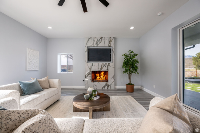 476 Spring Drive Toquerville, UT 84774 - Photo 68 of 95 Living room with wood finished floors, a ceiling fan, and a fireplace