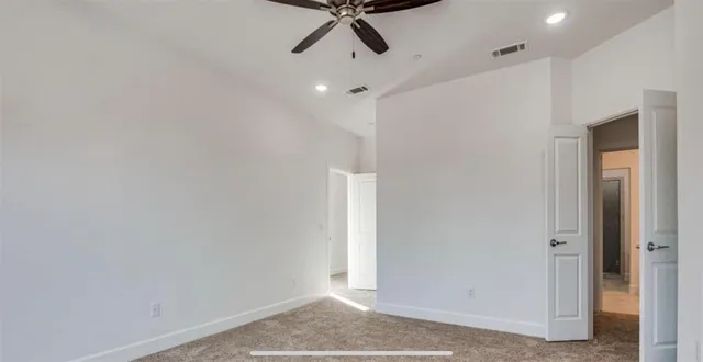 a kitchen with a sink cabinets and wooden floor