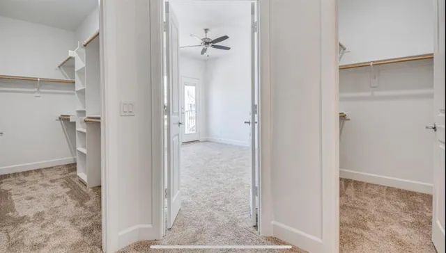 a bathroom with a granite countertop sink toilet mirror and bathtub