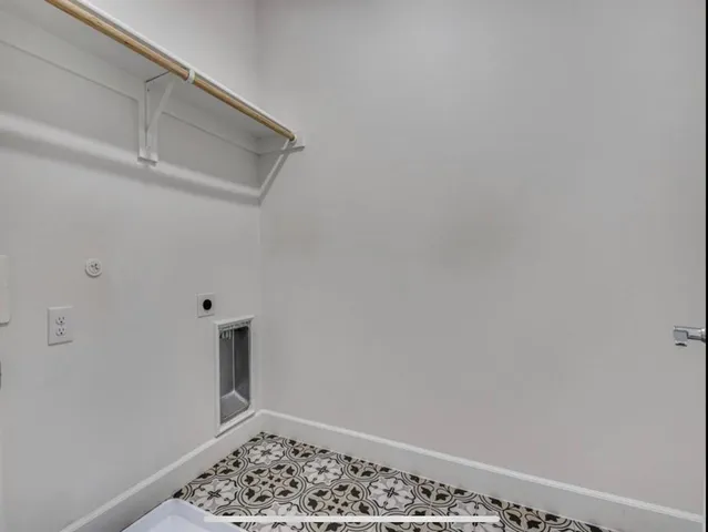 a view of a bathroom from a corridor