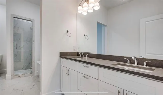 an empty room with window and ceiling fan