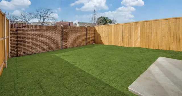 a white bath tub sitting next to a toilet