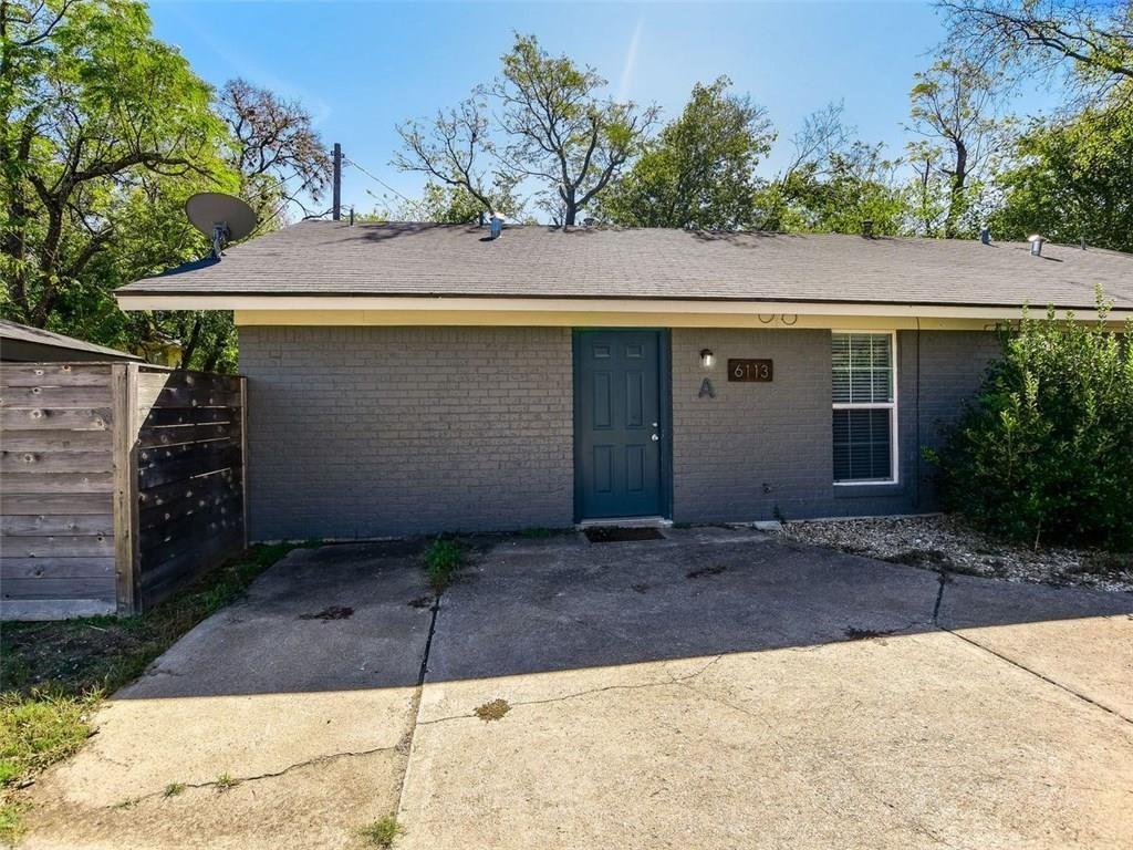 6113 Manor Road, Unit A Austin, TX 78723 - Photo 2 of 13 Classical brick construction meets modern convenience with dedicated off-street parking options.