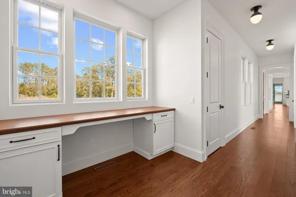 a large bathroom with a large tub and sink