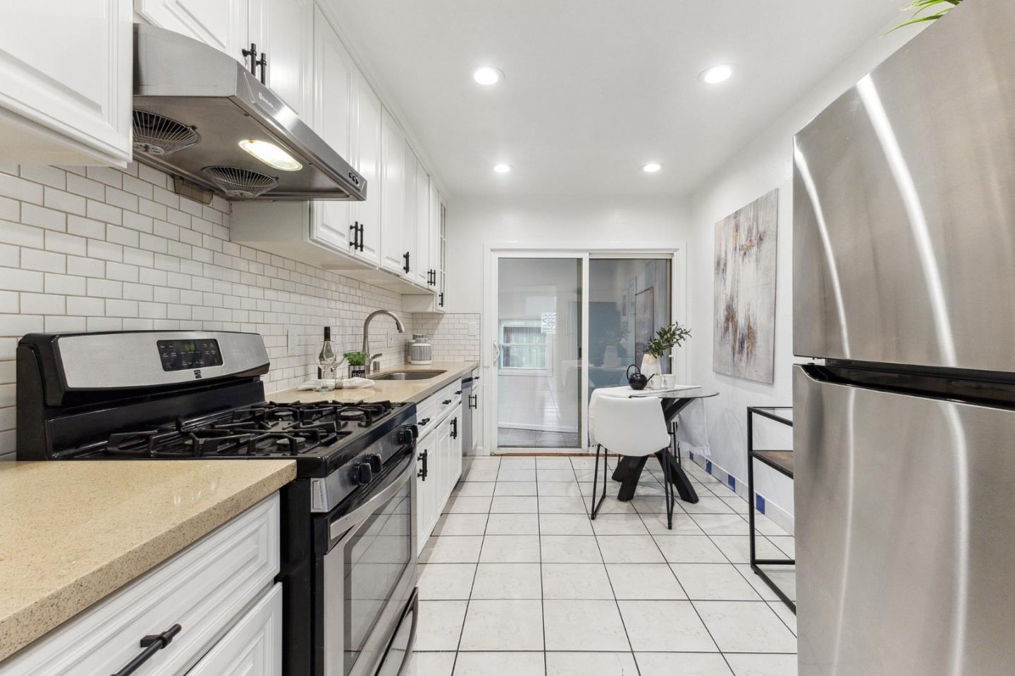 274 West Jackson Street Hayward, CA 94544 - Photo 13 of 29 a kitchen with stainless steel appliances a refrigerator a sink and wooden cabinets