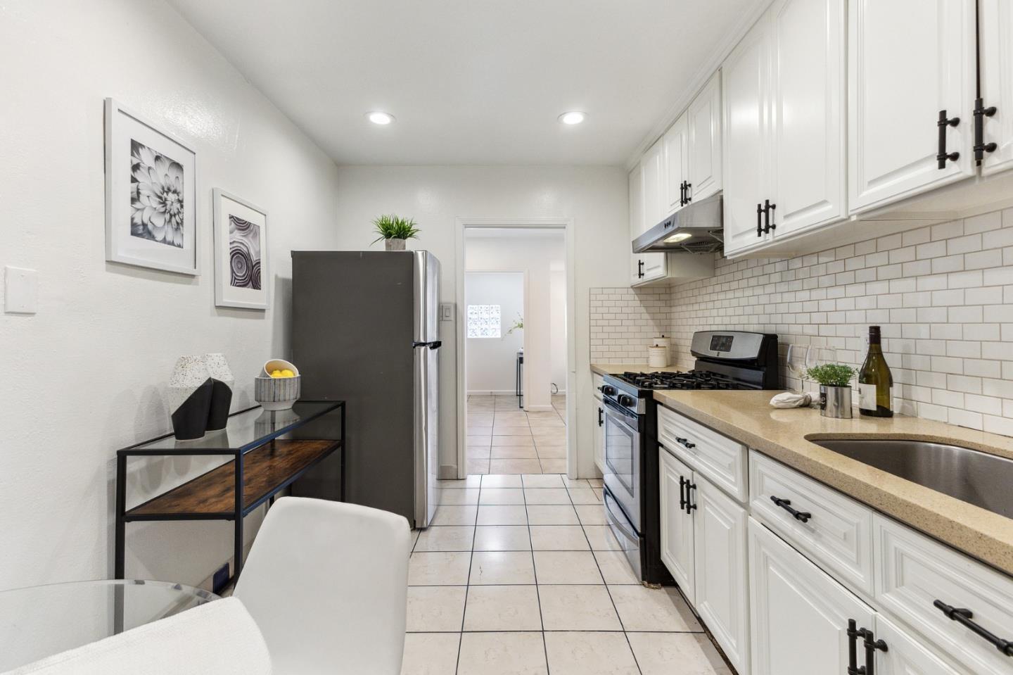 274 West Jackson Street Hayward, CA 94544 - Photo 17 of 29 a kitchen with a sink stainless steel appliances and cabinets