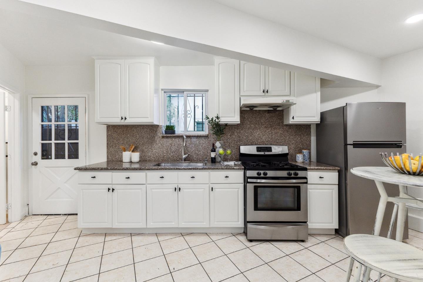 274 West Jackson Street Hayward, CA 94544 - Photo 23 of 29 a kitchen with granite countertop white cabinets and appliances