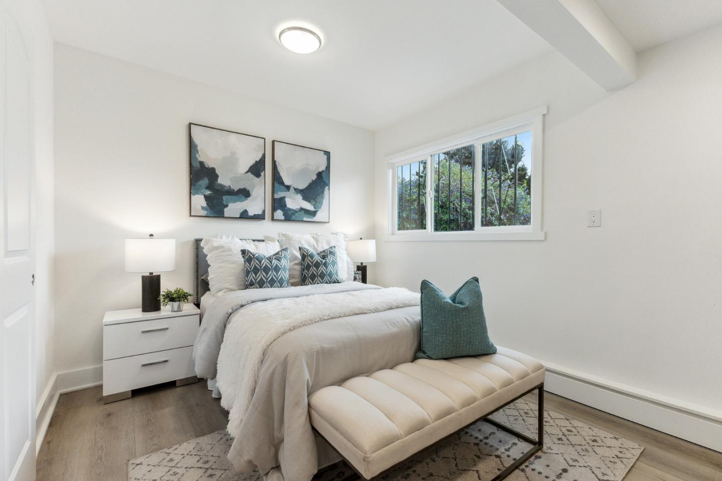 274 West Jackson Street Hayward, CA 94544 - Photo 25 of 29 a bedroom with a bed and wooden floor