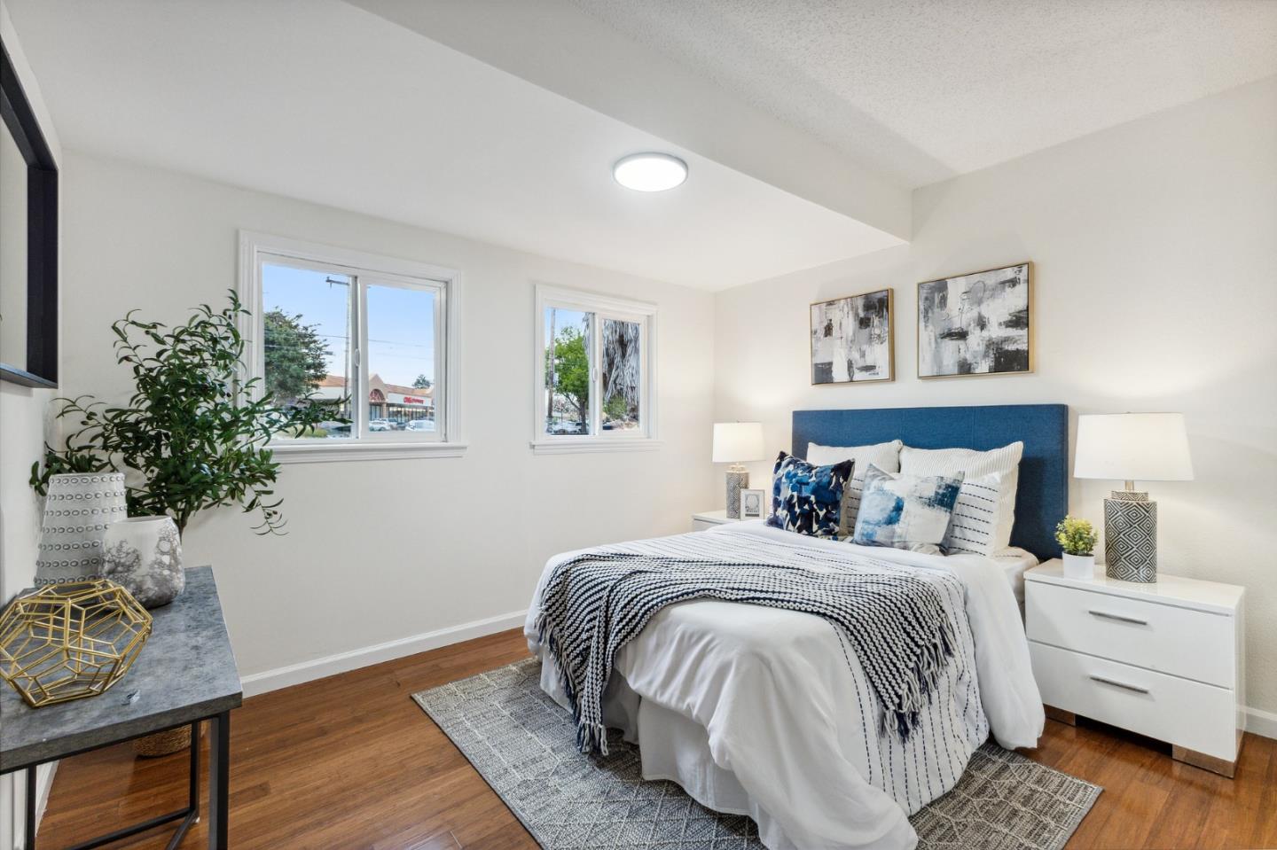 274 West Jackson Street Hayward, CA 94544 - Photo 9 of 29 a bedroom with a bed and a potted plant