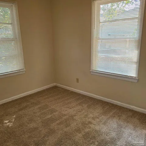 a bathroom with a toilet and a bathtub