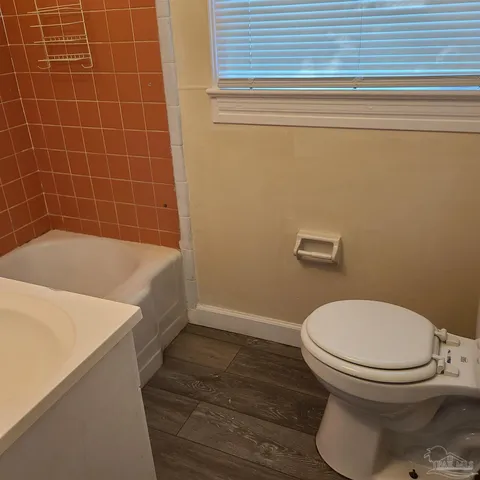 a view of a bathroom from a hallway
