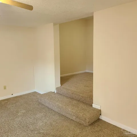 a view of a room with a hallway