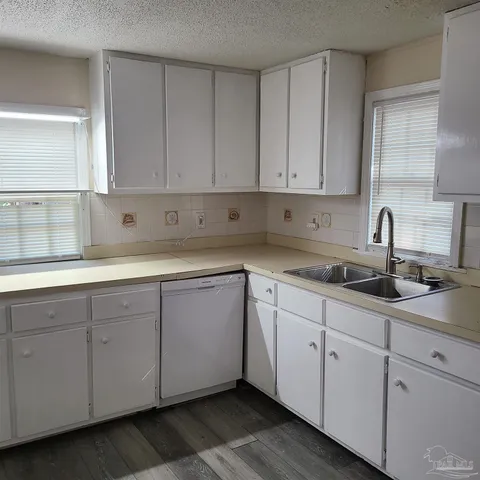 a white refrigerator freezer sitting in a kitchen