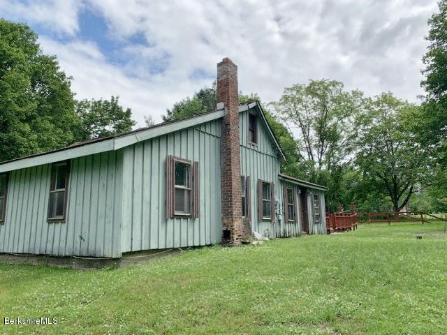 115 Lenox Road Richmond, MA 01254 - Photo 3 of 29 a front view of a house with garden