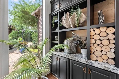 a view of outdoor space kitchen with potted plants