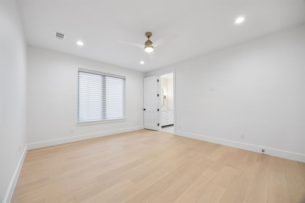 4311 Merrell Road Dallas, TX 75229 - Photo 25 of 30 wooden floor in an empty room with a window