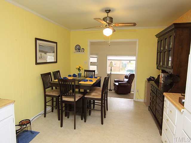 1529 Clermont Road Durham, NC 27713 - Photo 3 of 12 a view of a dining room and livingroom with furniture
