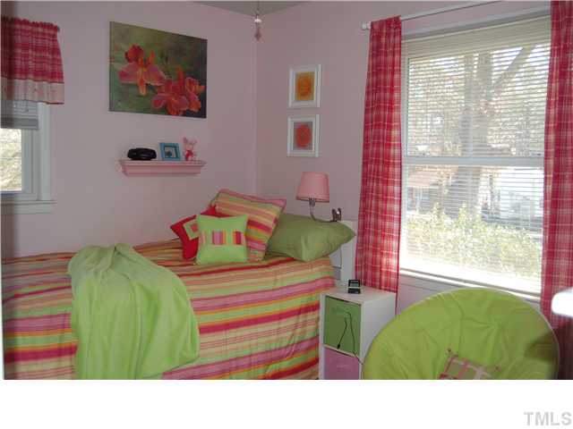 1529 Clermont Road Durham, NC 27713 - Photo 8 of 12 a bedroom with a bed and a window