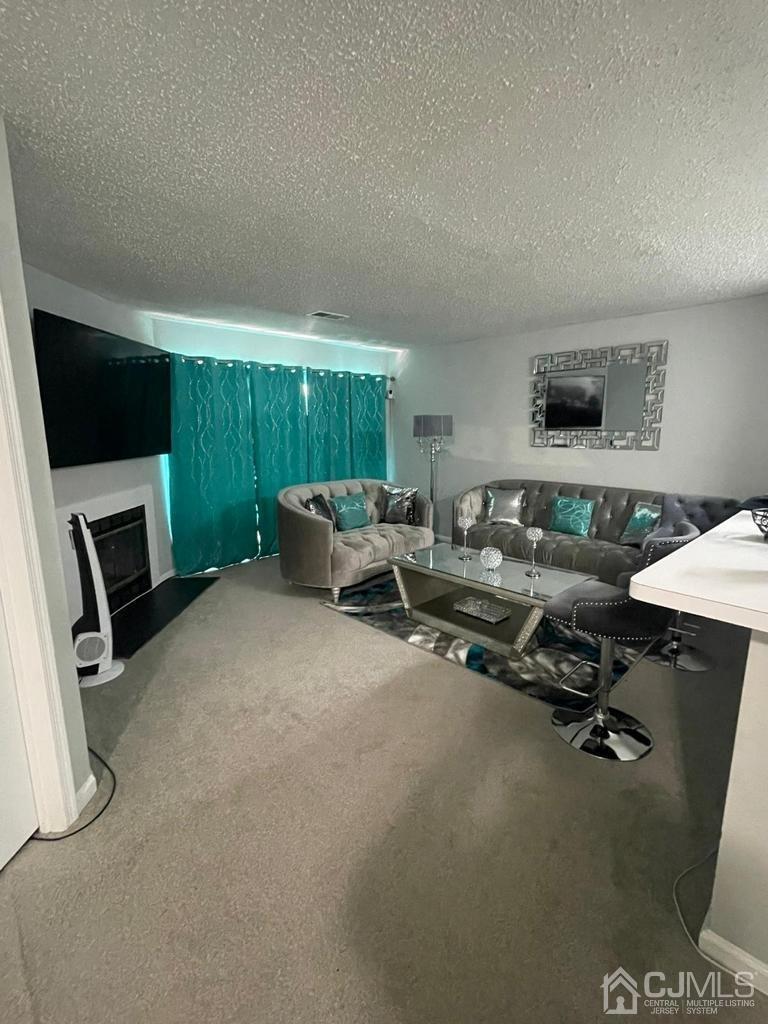 824 Edpas Road New Brunswick, NJ 08901 - Photo 2 of 13 a livingroom with workspace and a couch