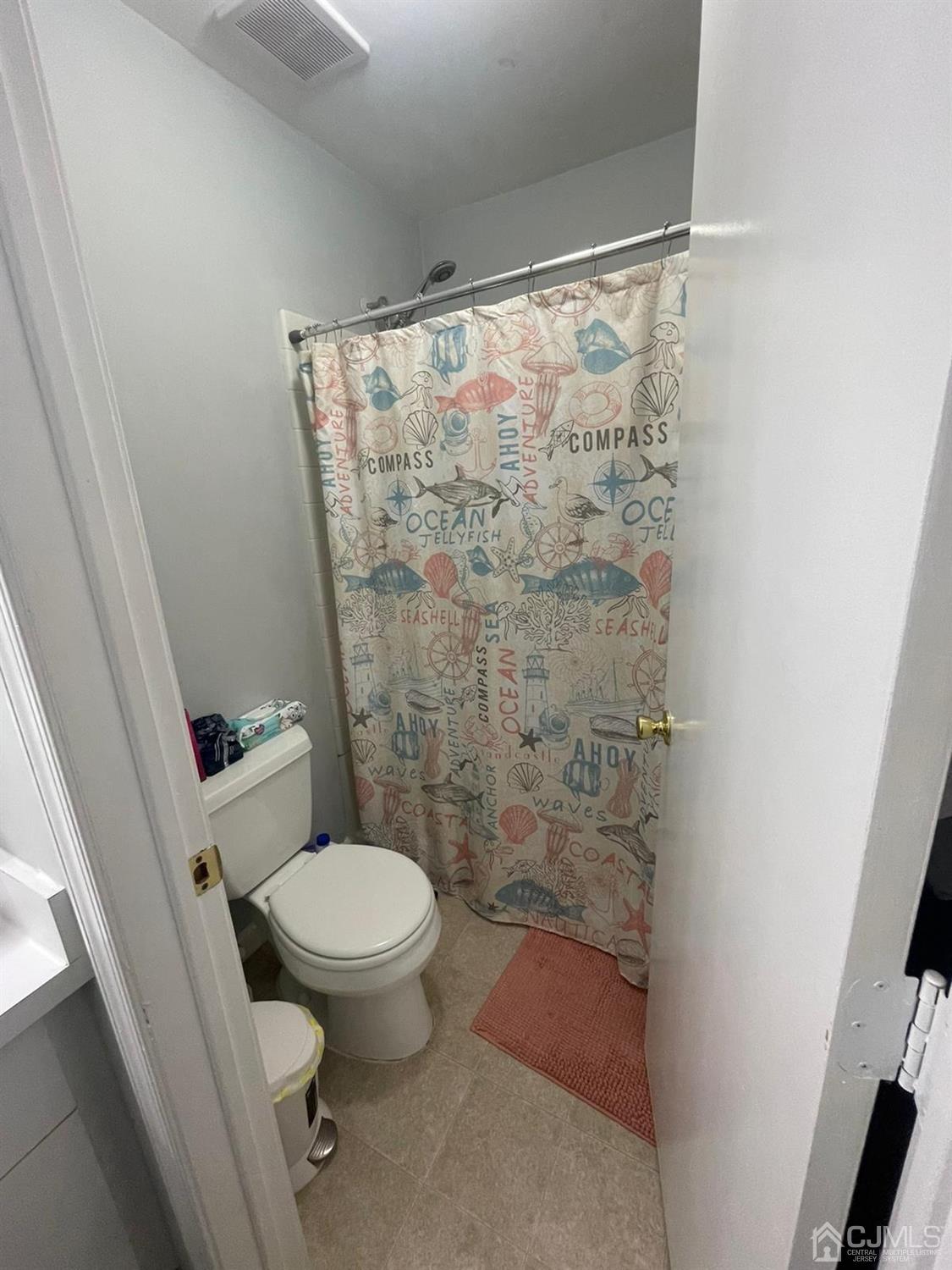 824 Edpas Road New Brunswick, NJ 08901 - Photo 6 of 13 a bathroom with a toilet and a shower