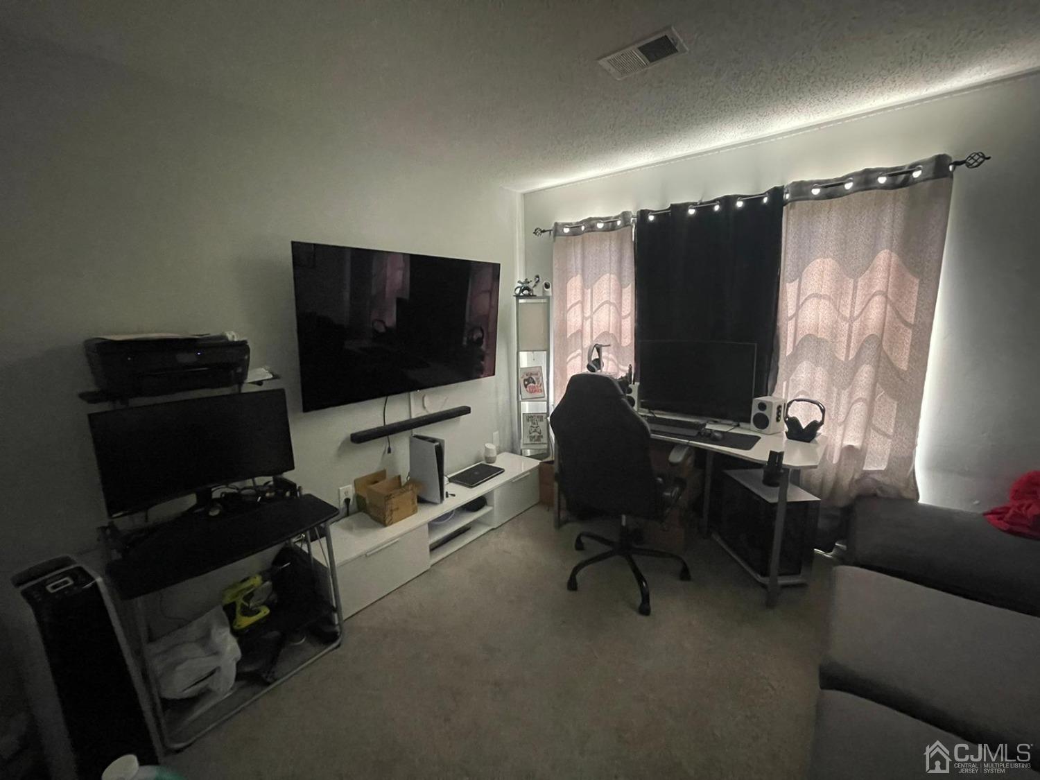 824 Edpas Road New Brunswick, NJ 08901 - Photo 8 of 13 a view of a livingroom with workspace and a window