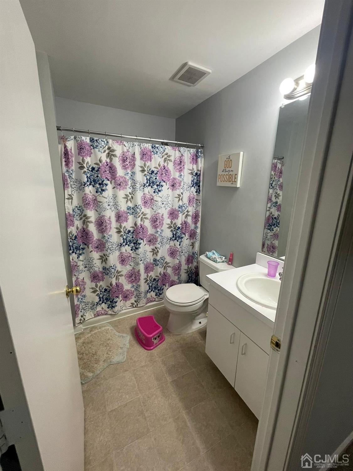 824 Edpas Road New Brunswick, NJ 08901 - Photo 9 of 13 a bathroom with a toilet sink and shower curtain