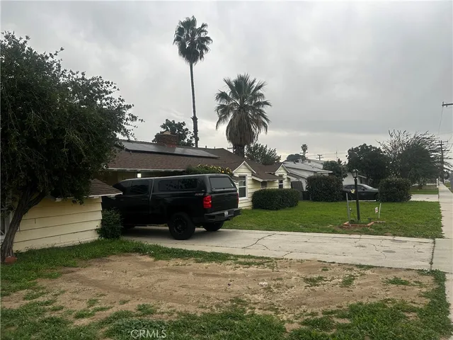 a view of backyard with a barn and a cactus plant
