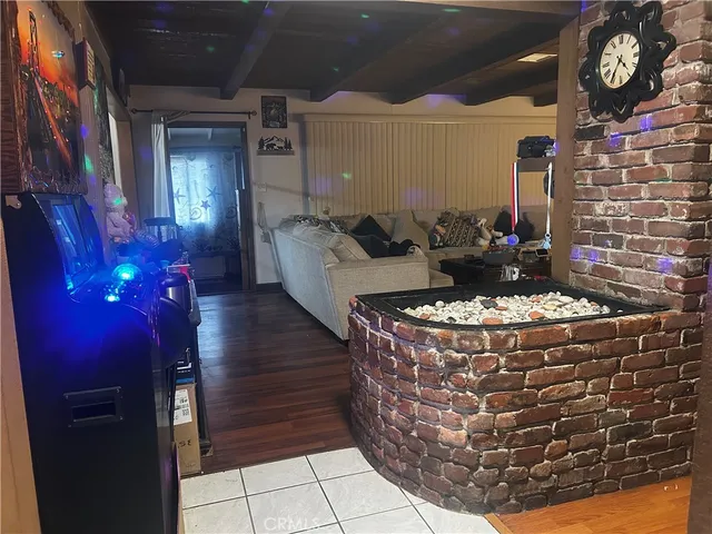 a living room with fireplace furniture and a fireplace