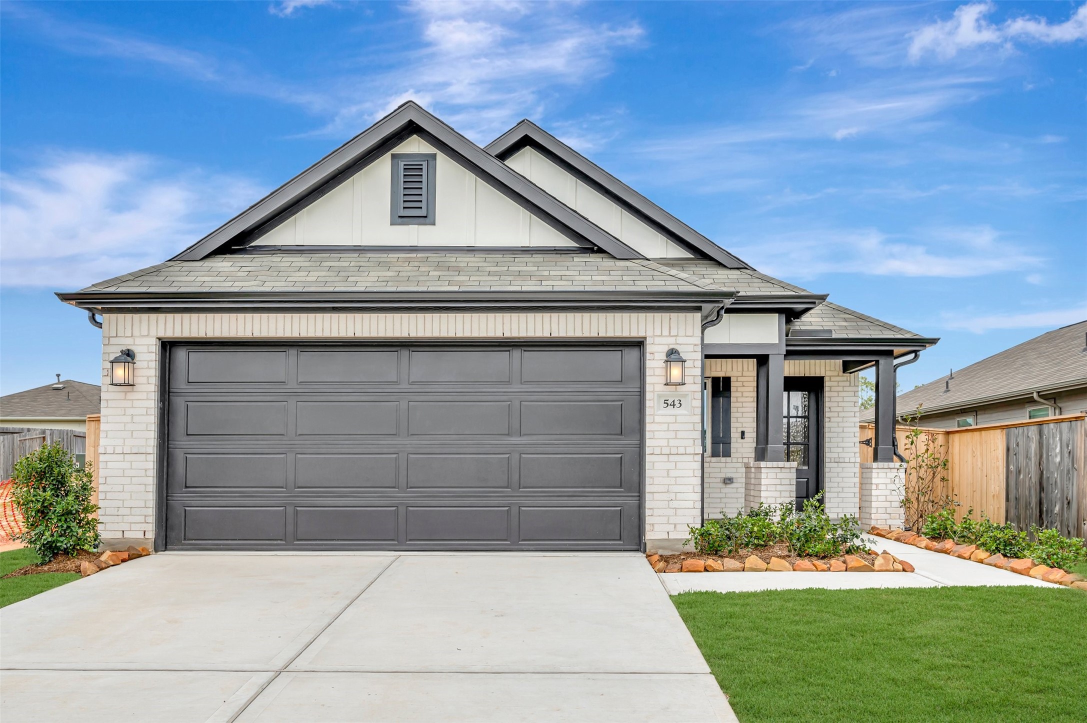 543 Flower Reed Court Magnolia, TX 77354 - Photo 13 of 46 a front view of a house with a yard