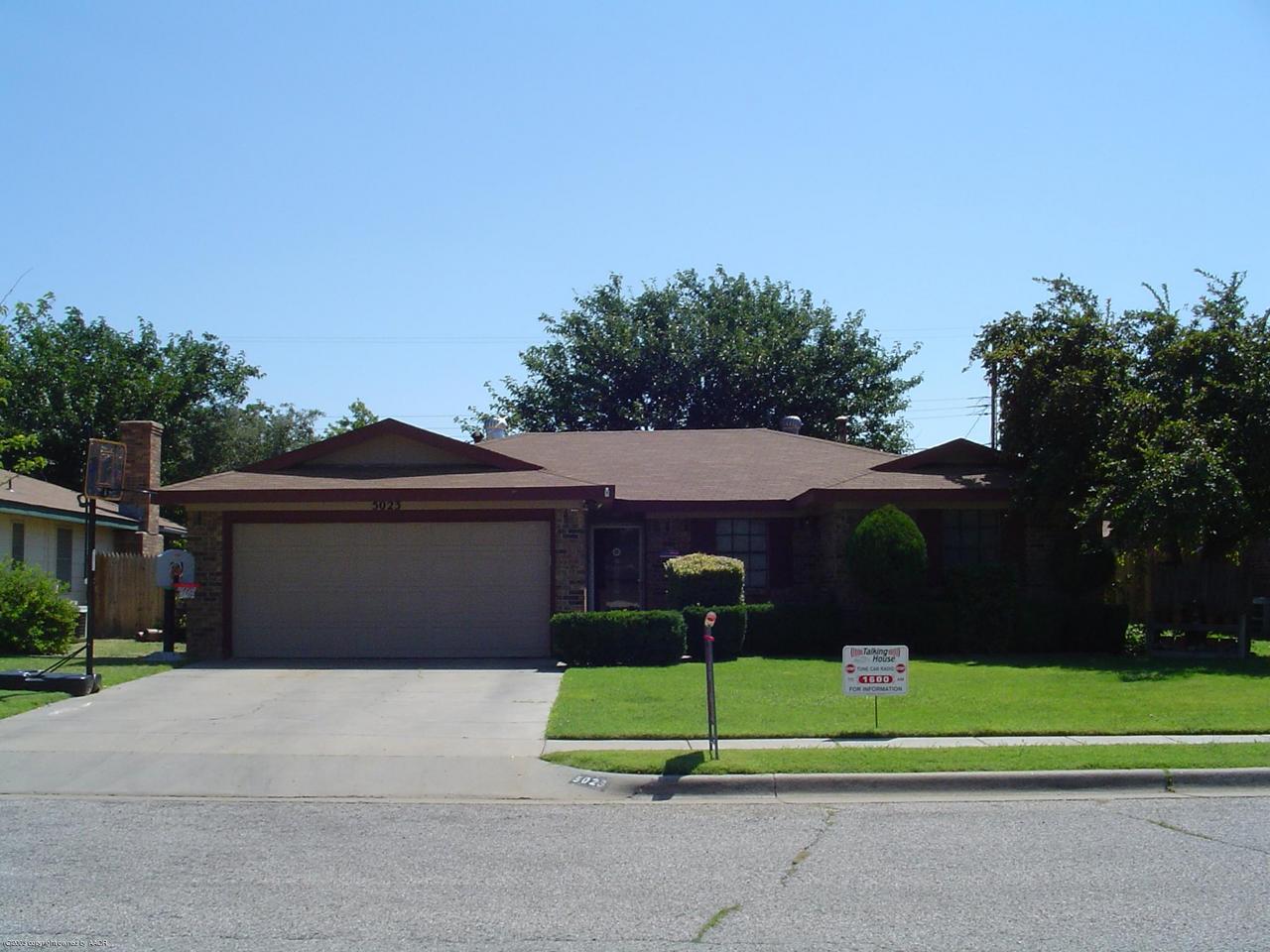 5023 South Milam Street Amarillo, TX 79110 - Photo 1 of 1 a front view of house with a garden