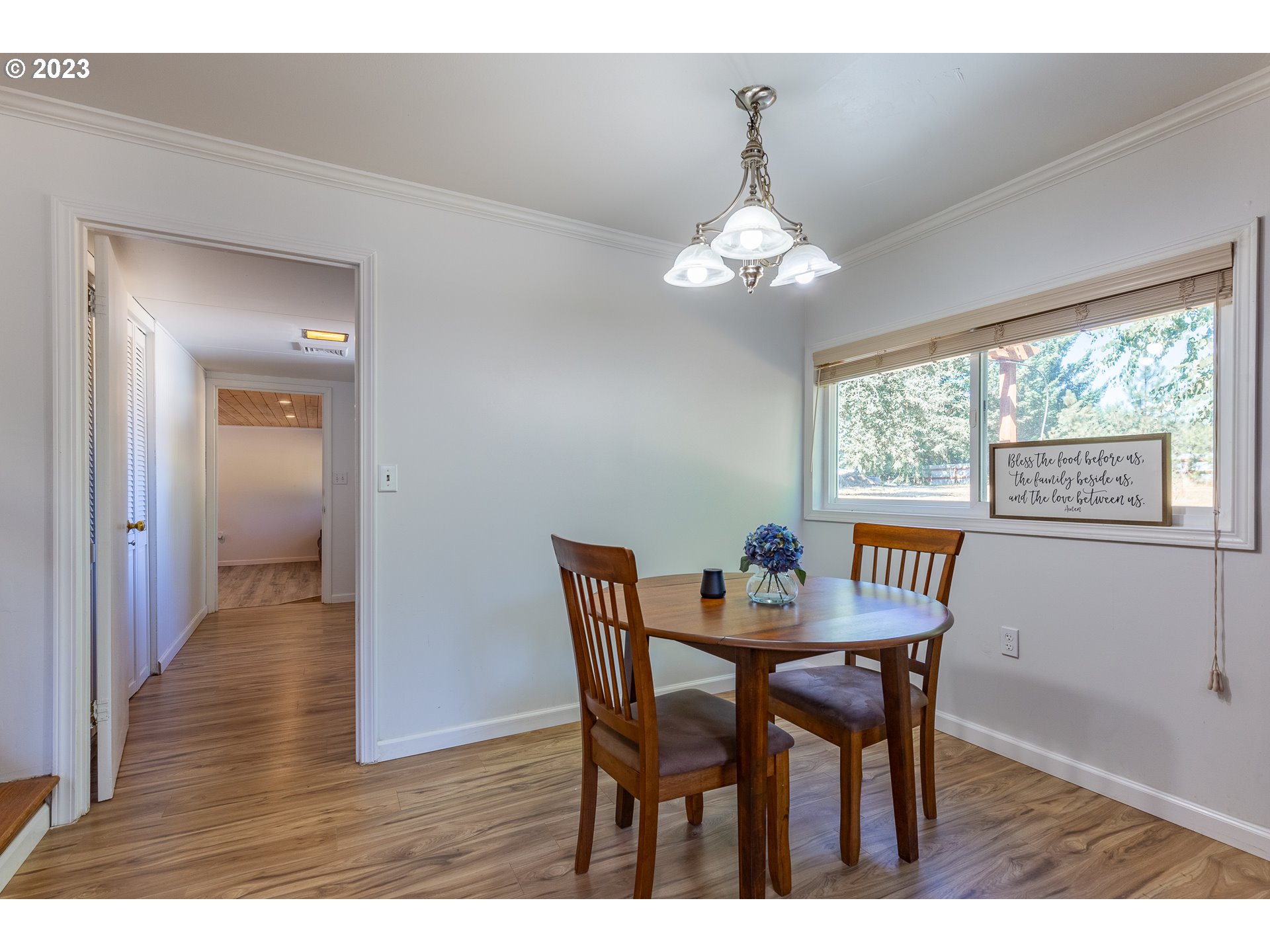 34869 Ede Road Lebanon, OR 97355 - Photo 6 of 42 a view of a dining room with furniture wooden floor and chandelier