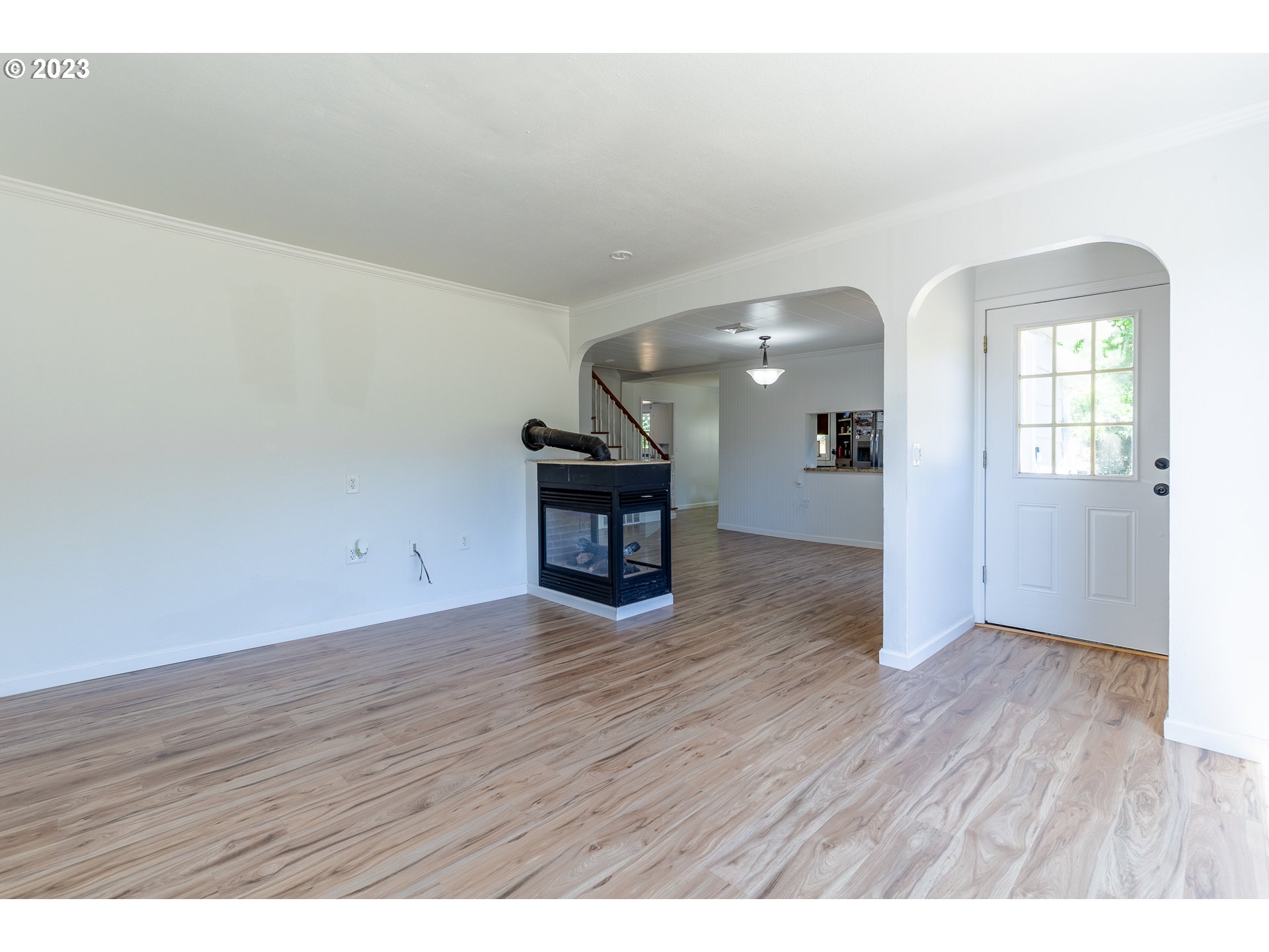 34869 Ede Road Lebanon, OR 97355 - Photo 8 of 42 an empty room with wooden floor and windows