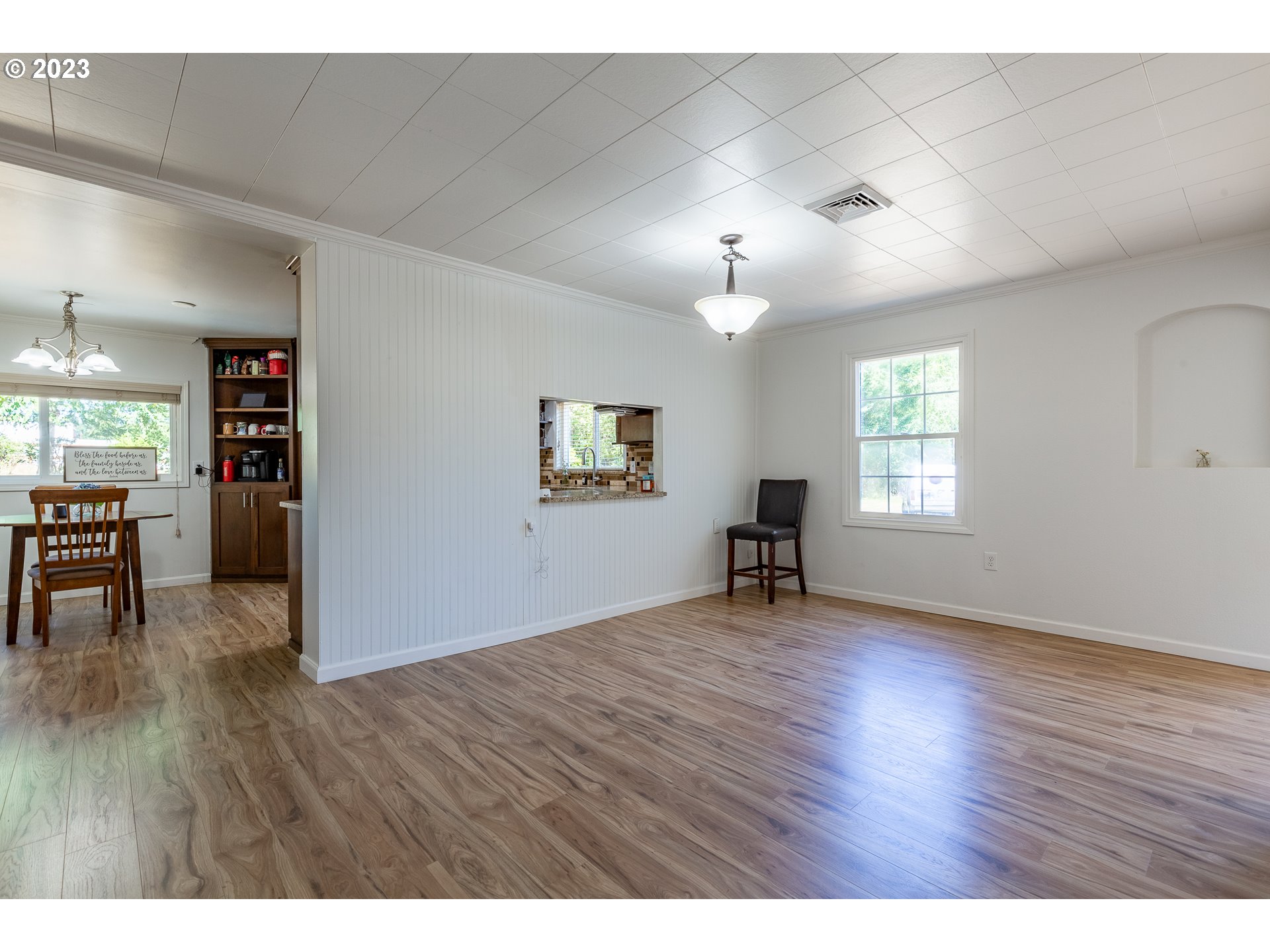 34869 Ede Road Lebanon, OR 97355 - Photo 10 of 42 a view of an empty room with window and wooden floor