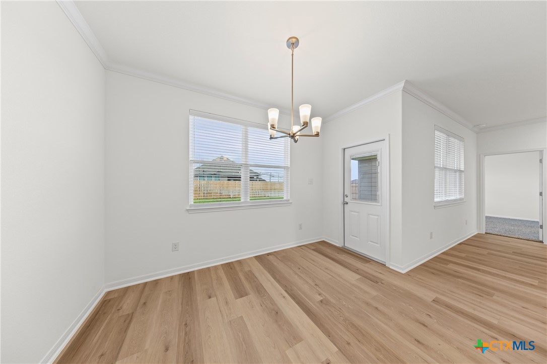 7806 Timber Holw Lane Temple, TX 76502 - Photo 14 of 30 a view of empty room with wooden floor and fan