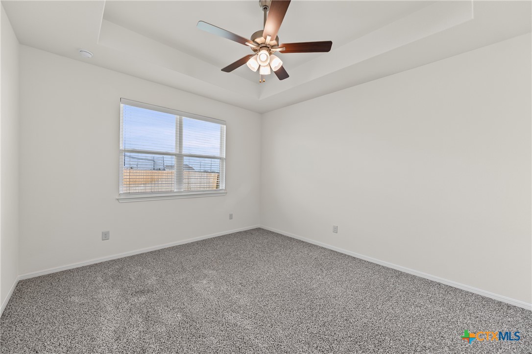 7806 Timber Holw Lane Temple, TX 76502 - Photo 23 of 30 an empty room with windows and fan