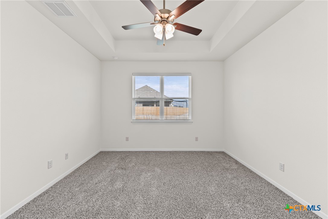 7806 Timber Holw Lane Temple, TX 76502 - Photo 25 of 30 an empty room with a window and a fan