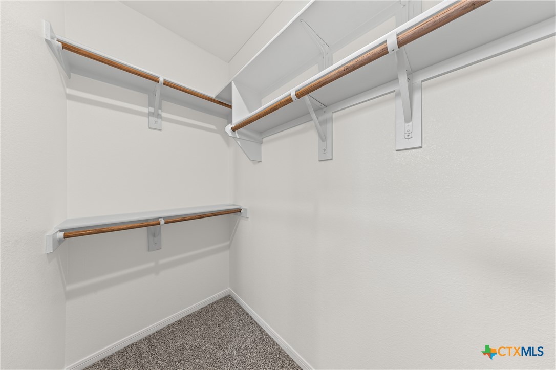 7806 Timber Holw Lane Temple, TX 76502 - Photo 28 of 30 a view of walk in closet with empty racks