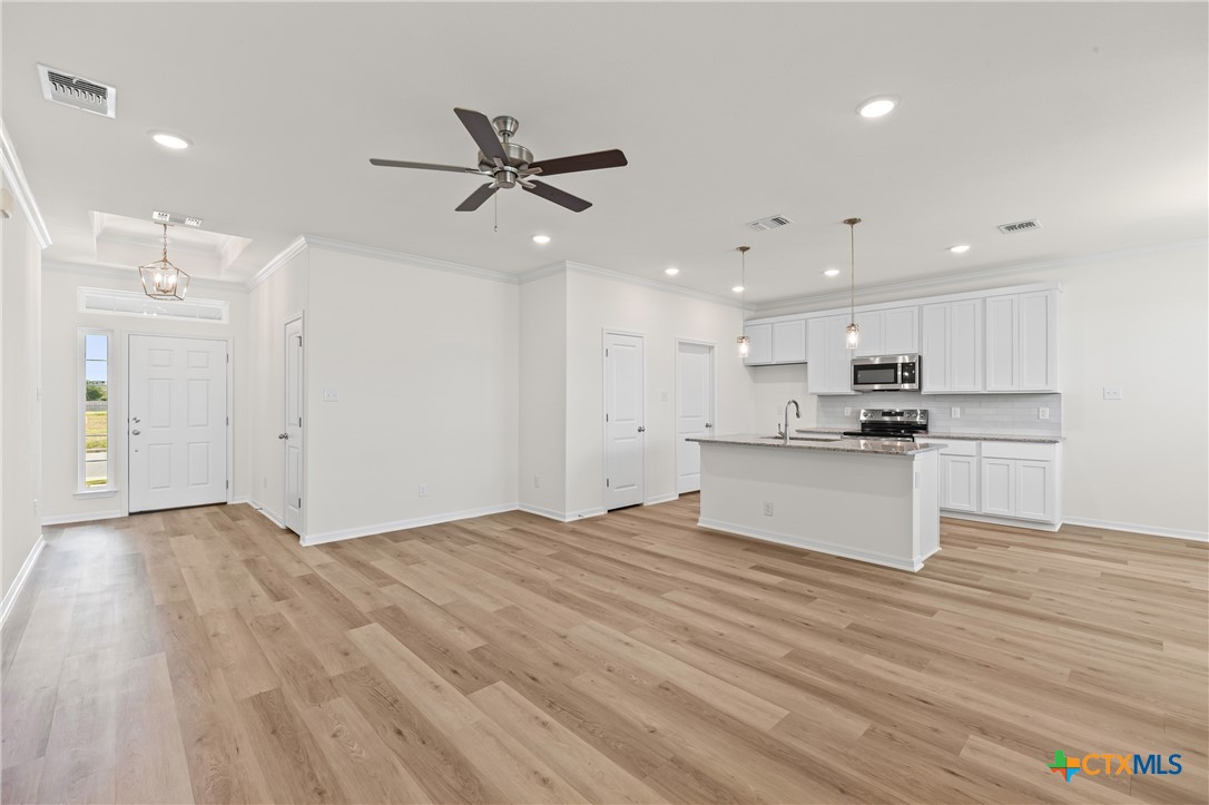 7806 Timber Holw Lane Temple, TX 76502 - Photo 6 of 30 a view of kitchen with granite countertop cabinets and wooden floor