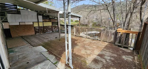 a view of balcony with wooden floor and wall