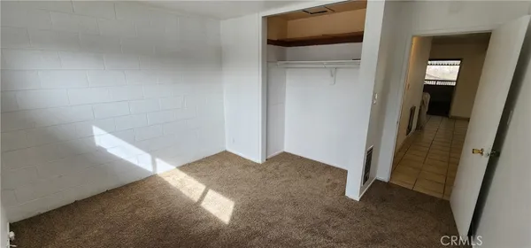 a kitchen with cabinets and window