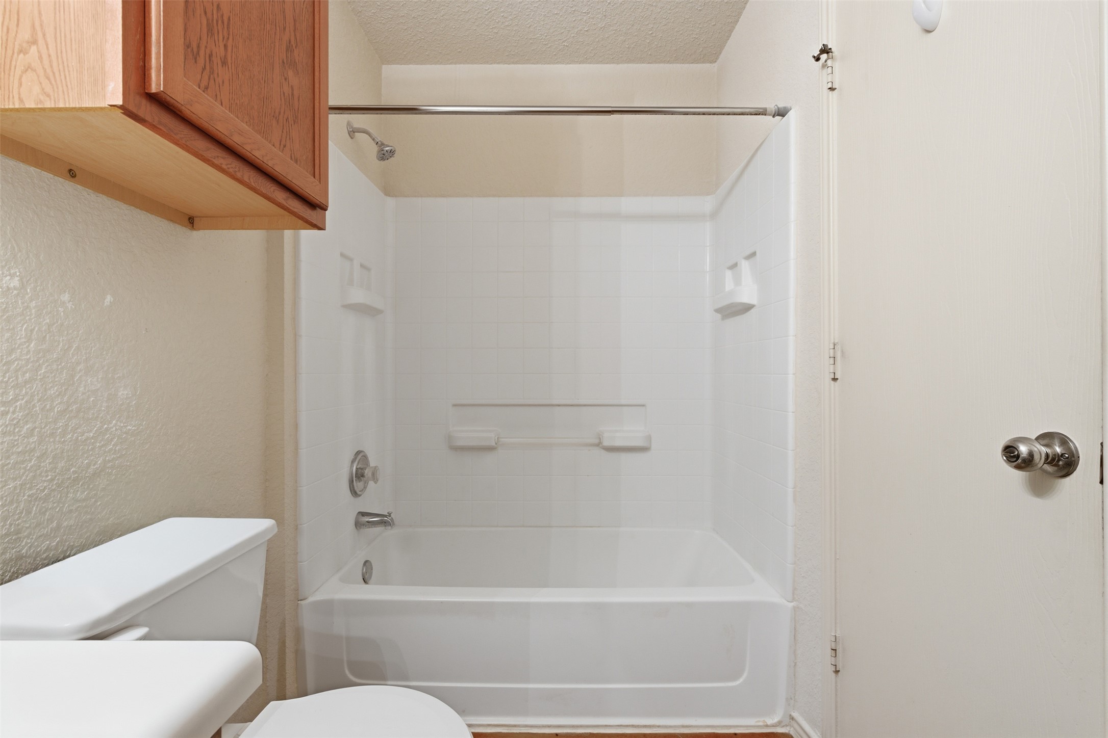 4529 Secure Lane, Unit 31 Austin, TX 78725 - Photo 24 of 38 a bathroom with a shower and a toilet