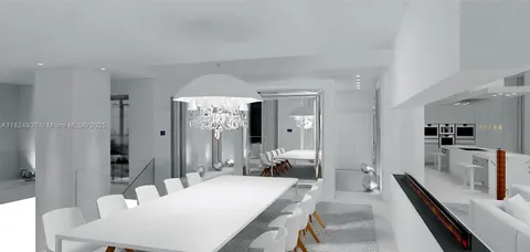 a living room with a table and a flat screen tv