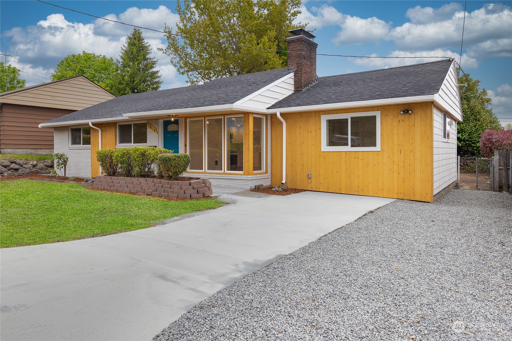 a front view of a house with a yard and porch