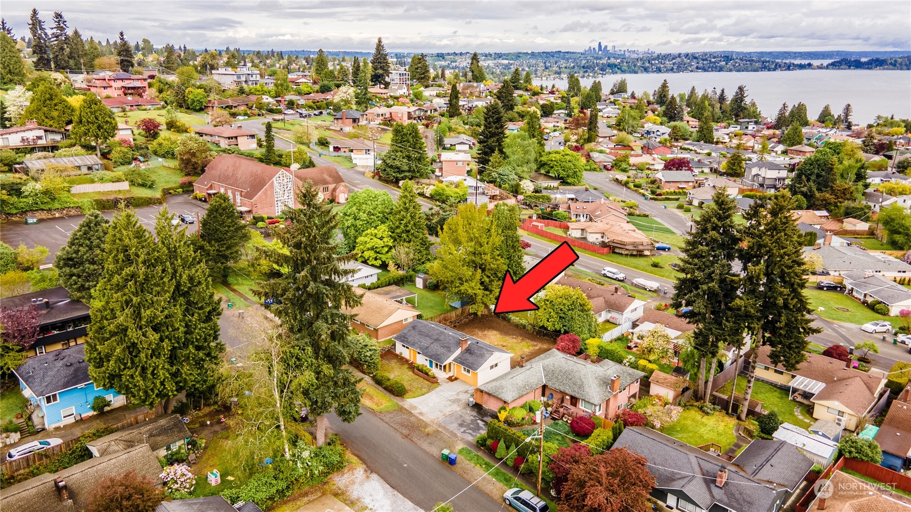 7614 South 113th Street Seattle, WA 98178 - Photo 11 of 24 an aerial view of residential houses with outdoor space and swimming pool