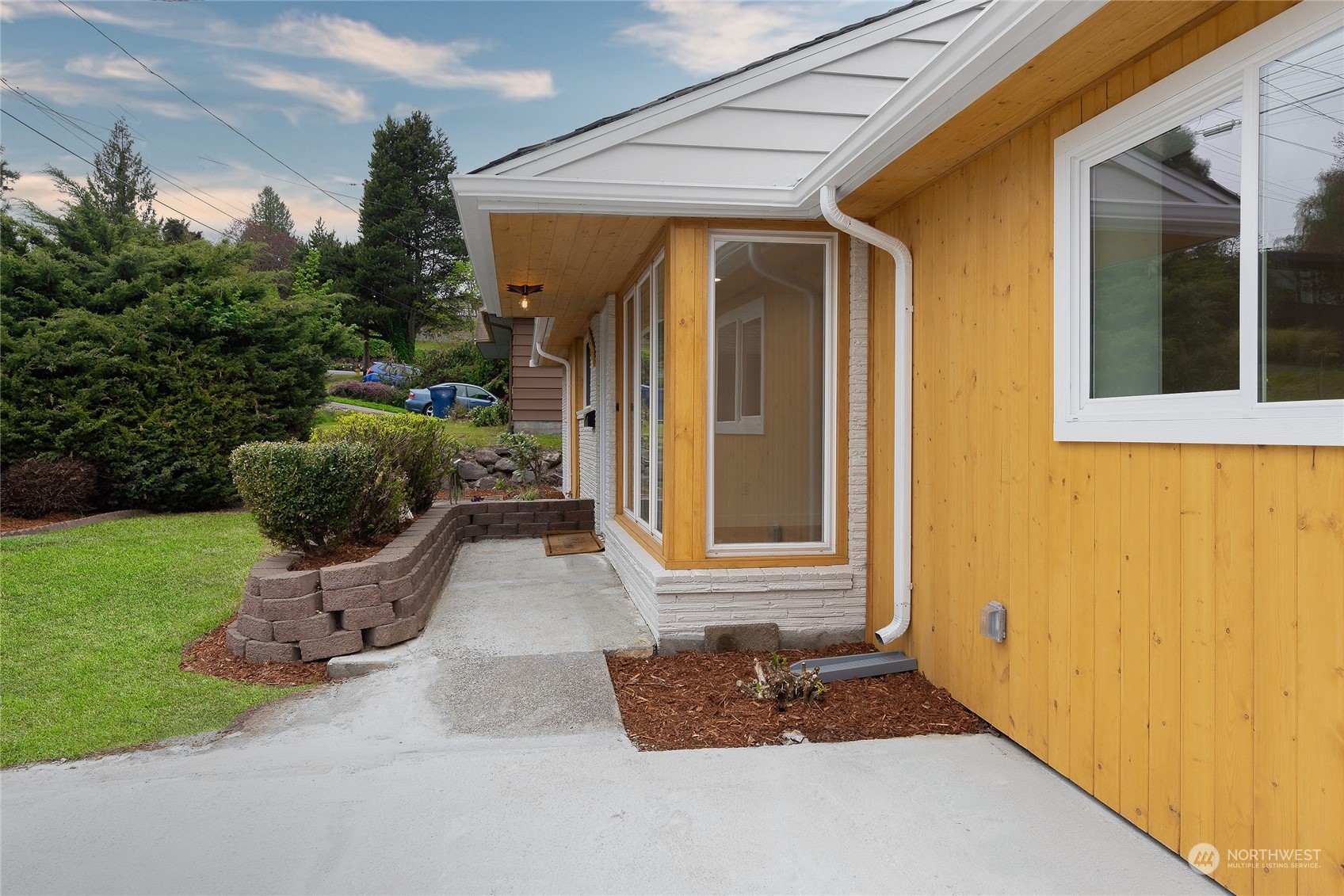 7614 South 113th Street Seattle, WA 98178 - Photo 2 of 24 a front view of a house with a yard